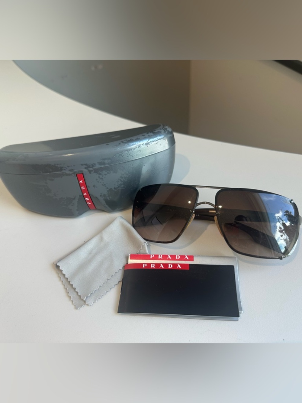 Prada Black Metal Aviator Sunglasses with Brown Gradient Lenses